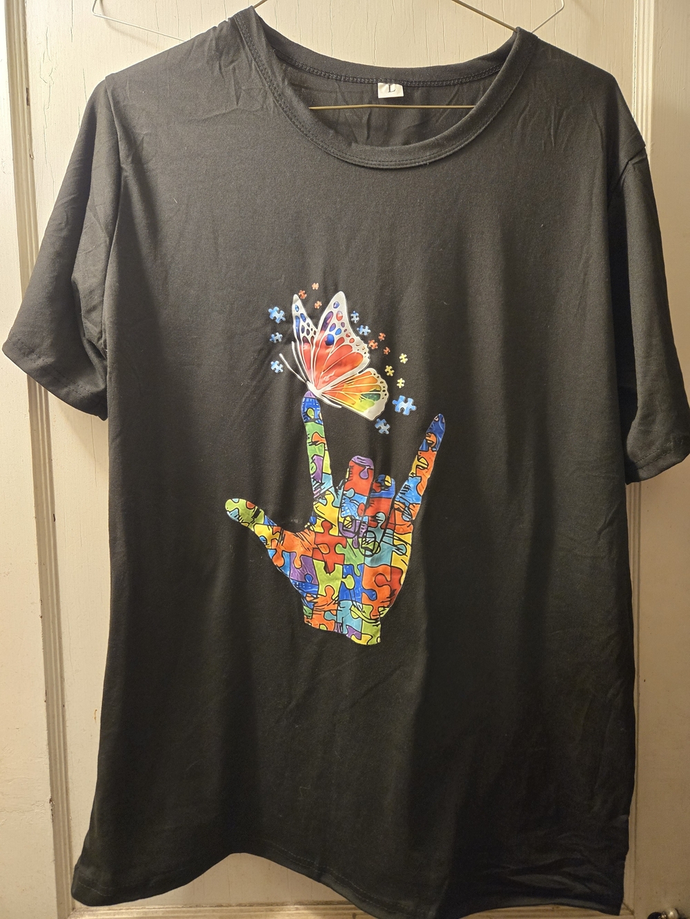 AUTISM Black Short Sleeve Tee with Colorful Puzzle Hand & Butterfly Graphic